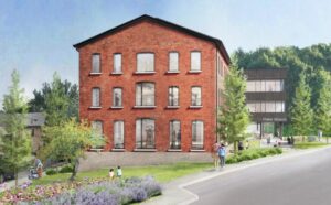 Exterior view of the Shaker Museum. A 3 story solid brick building set on beautifully landscaped lawns and gardens.